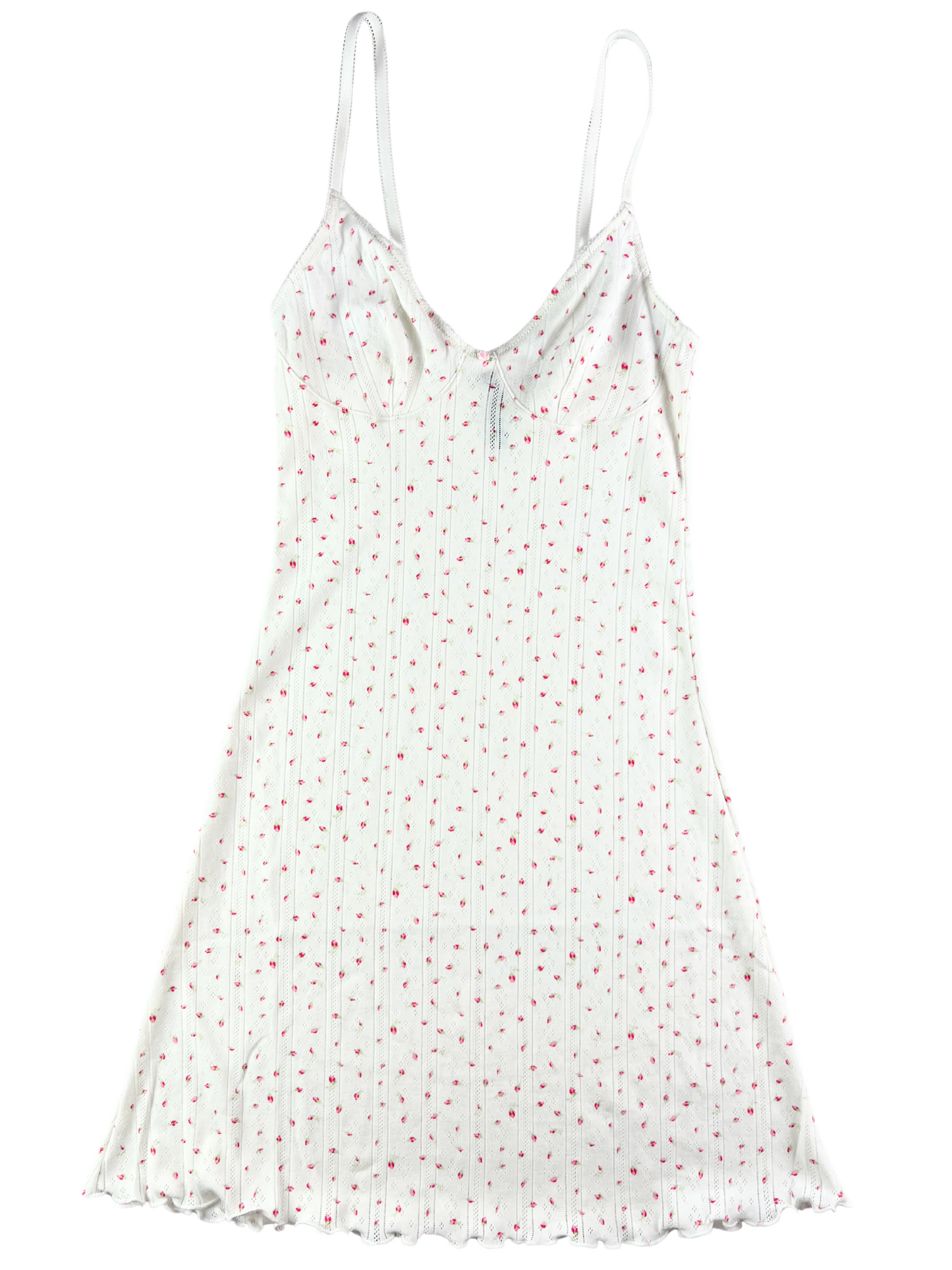 A white cotton pointelle slip dress with red dots and picot trim, featuring a ruffle hem and adjustable straps.