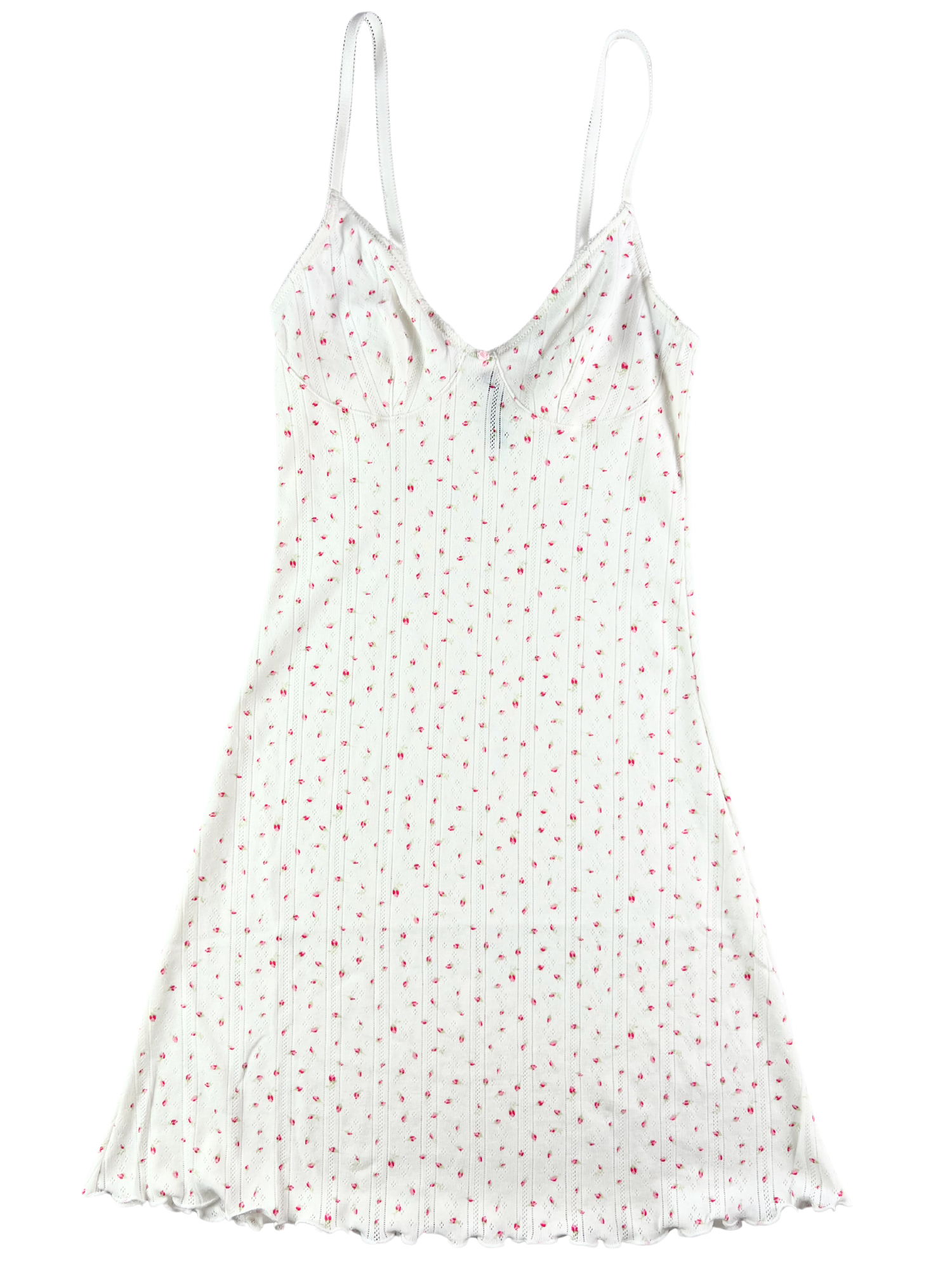 A white cotton pointelle slip dress with red dots and picot trim, featuring a ruffle hem and adjustable straps.