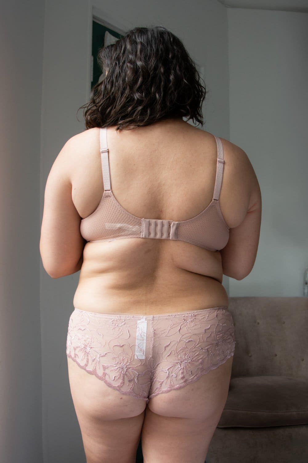 Chantelle Fleurs Demi Bra in authentic pink, back view on a model, full-body, distance shot.