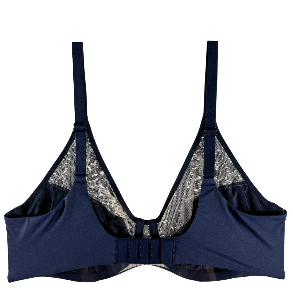 A navy blue underwire bra with adjustable shoulder straps, a center gore, and a sheer silver sequined inner lining, shown against a plain white background.