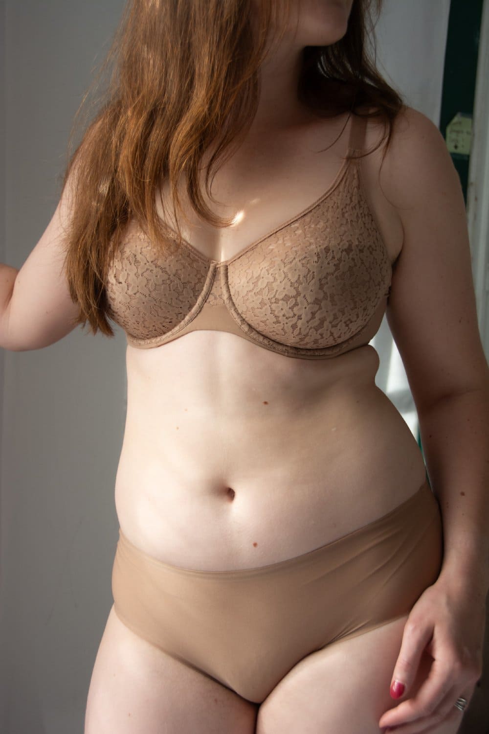 Chantelle norah comfort underwire bra in nude blush coffee latte, front view on a model, full-body, distance shot.