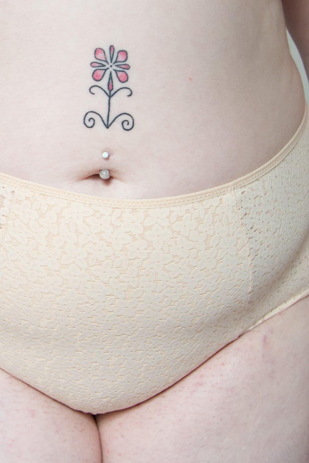 Chantelle norah high waist brief in nude blush, front view on a model, close-up.