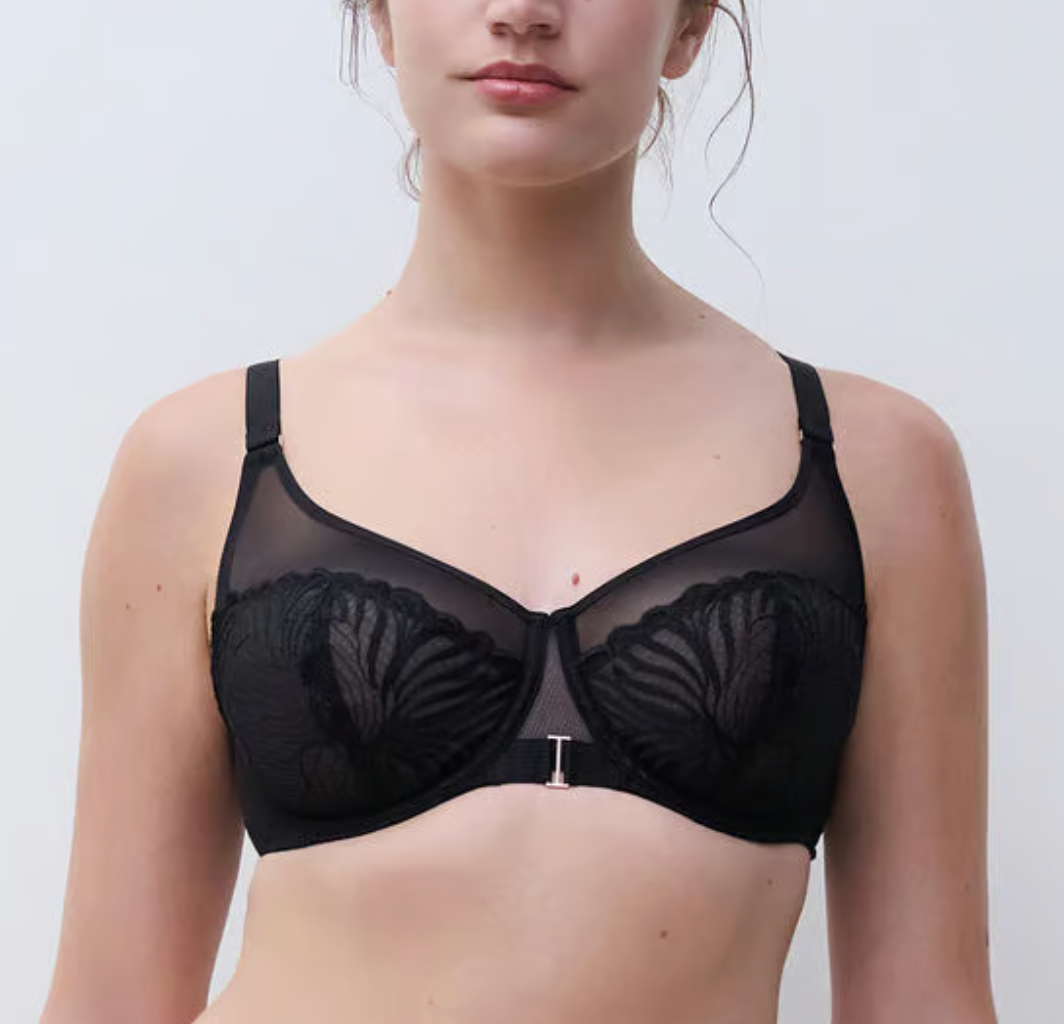 Black bra worn by a model on a plain background