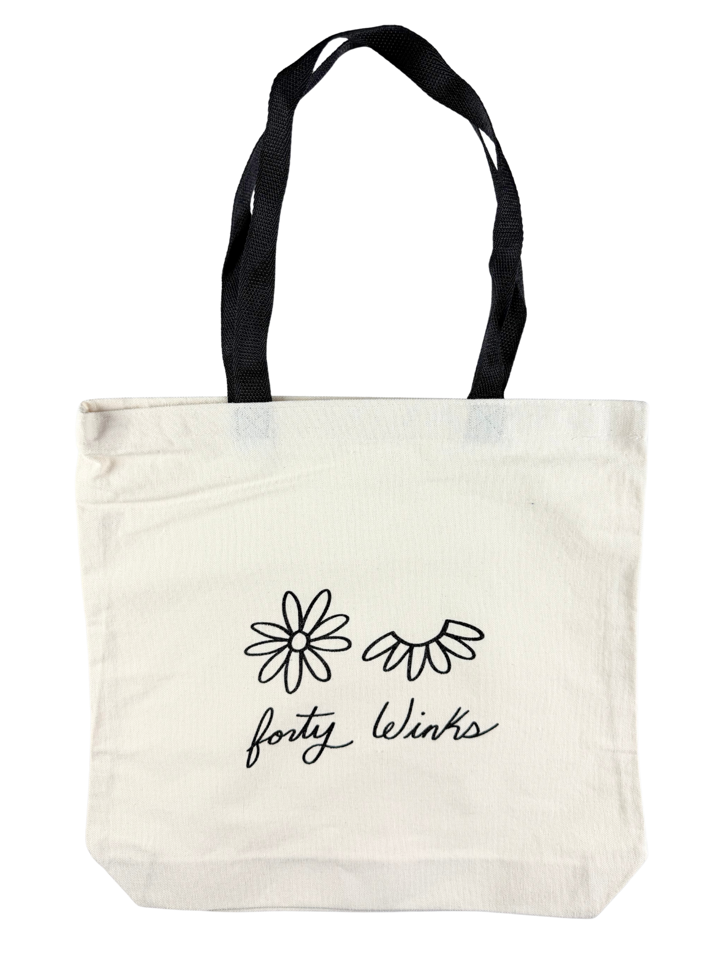 Tote bag with black floral designs and 'forty Winks' text on a white background