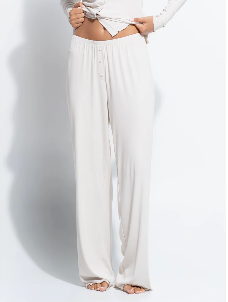 White wide-leg pants worn by a person on a white background