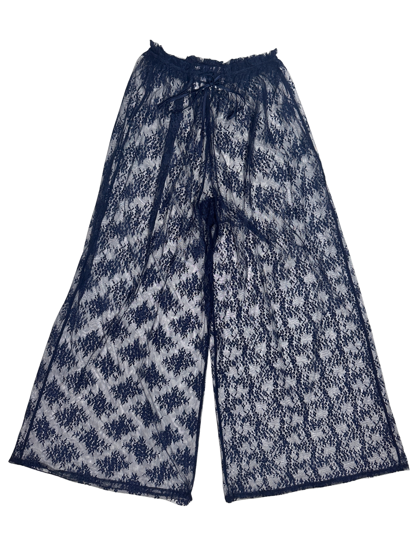 A pair of wide-leg pants featuring a navy blue and white ikat-style woven pattern, displayed flat against a solid white background.