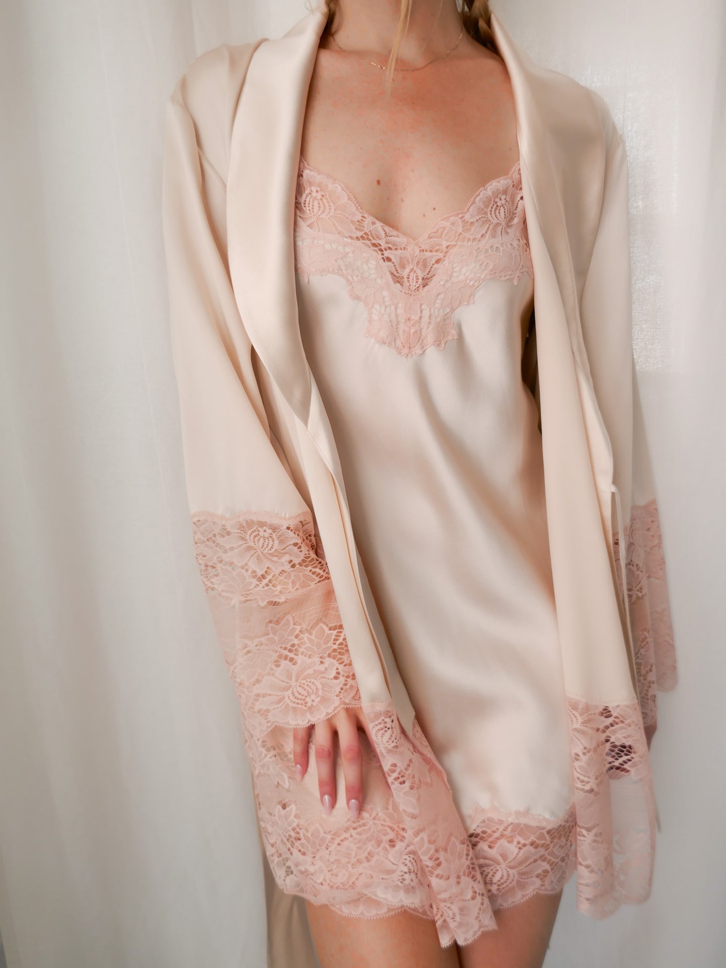 Lace-trimmed nightgown with matching robe on a plain background