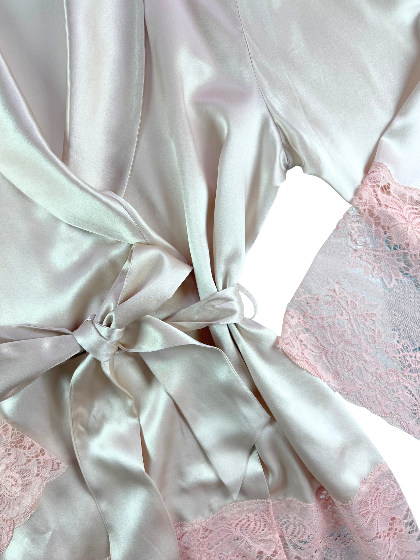 White satin robe with pink lace trim on a white background