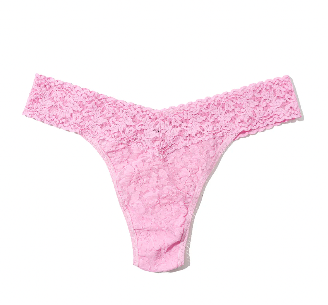 Pink lace thong on a white background