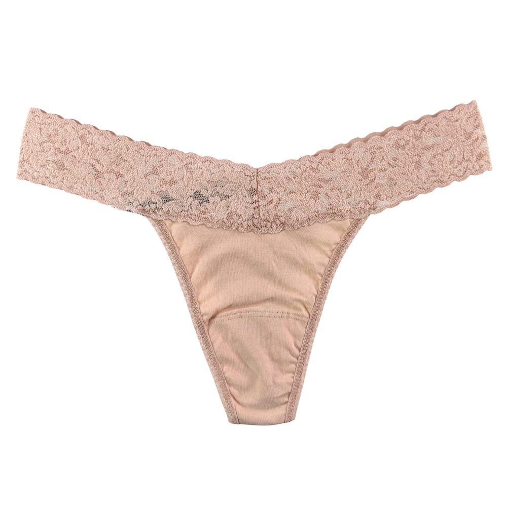 Beige lace thong on a white background