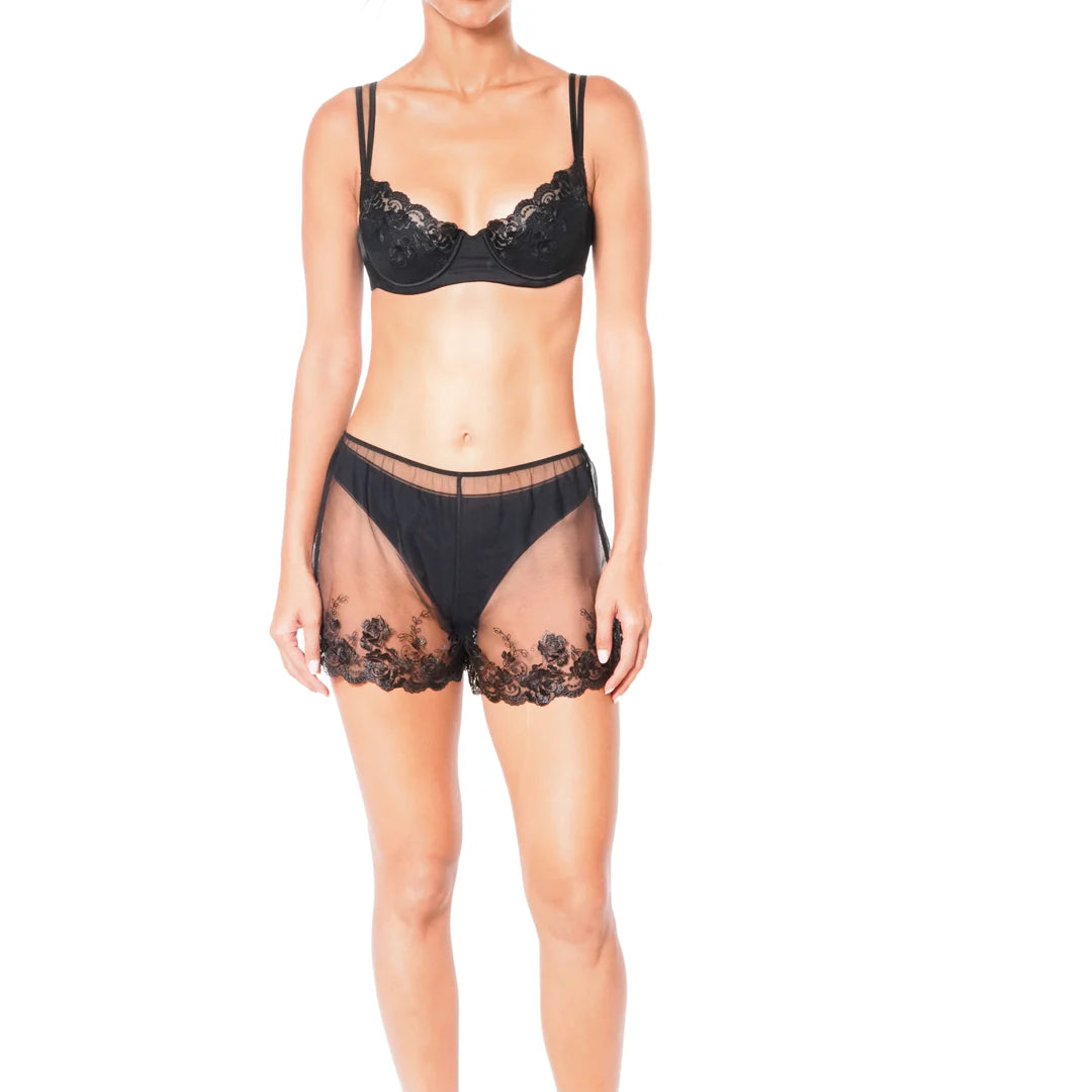 Black lace lingerie set on a white background