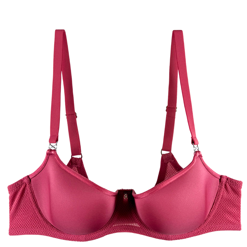 A pink underwire bra with textured mesh side panels and adjustable shoulder straps, shown against a plain white background.