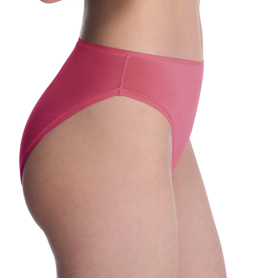 A close-up side view of a model wearing high-waisted pink underwear against a plain white background.