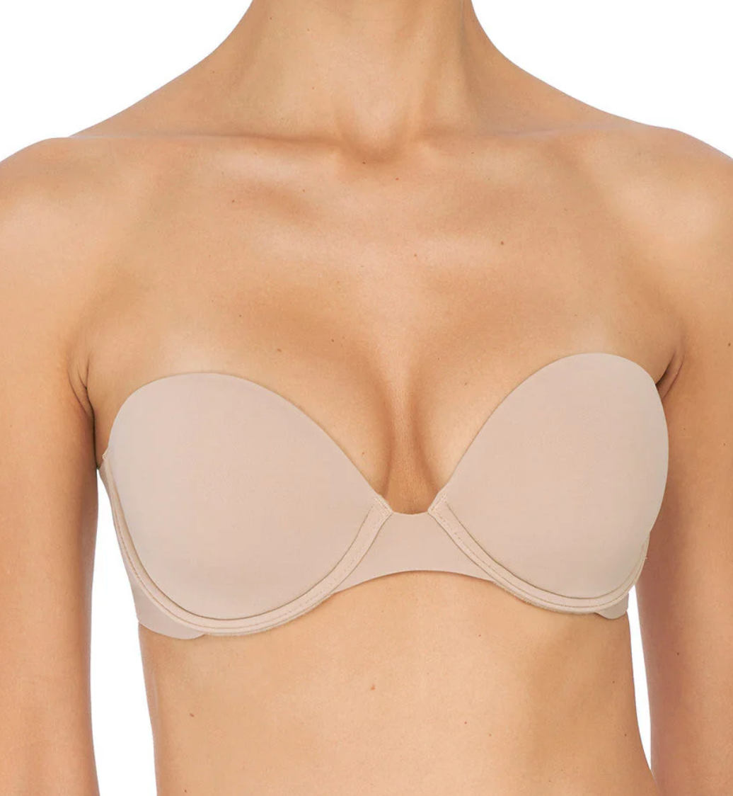Beige strapless bra on a white background