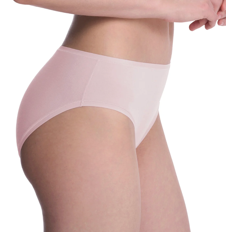 A close-up of a model wearing a light pink seamless high-waisted brief or panty against a plain white background.