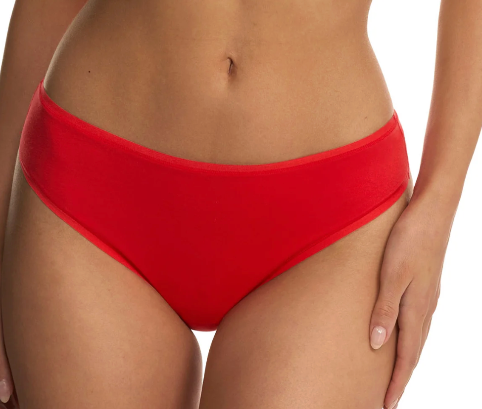 A close-up of a model wearing bright red high-waisted bikini bottoms against a clean white background.