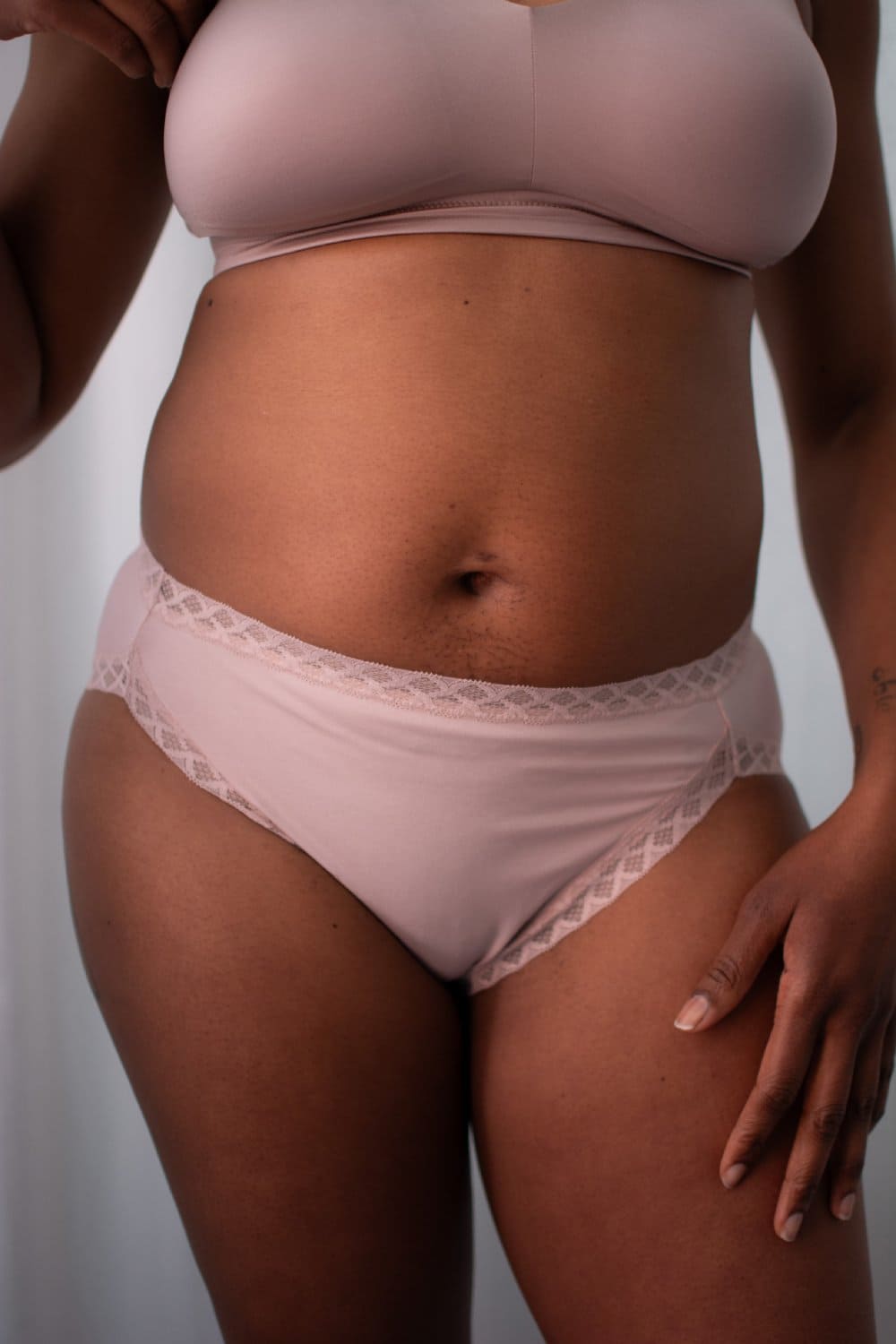 Natori bliss french cut brief in rose beige, front view on a model, close-up.