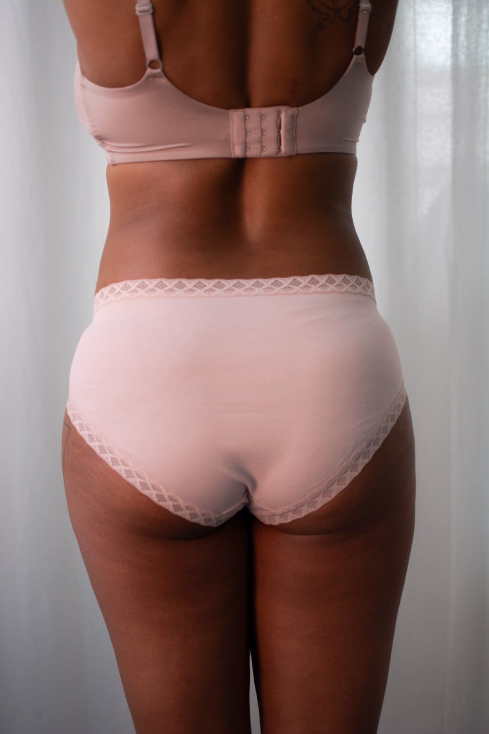 Natori bliss french cut brief in rose beige, back view on a model, close-up.