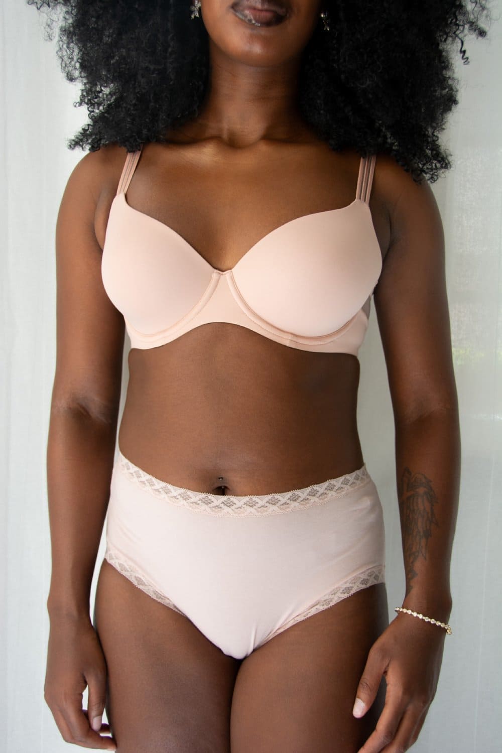 Natori Bliss full brief in rose beige, front view on a model, close-up.