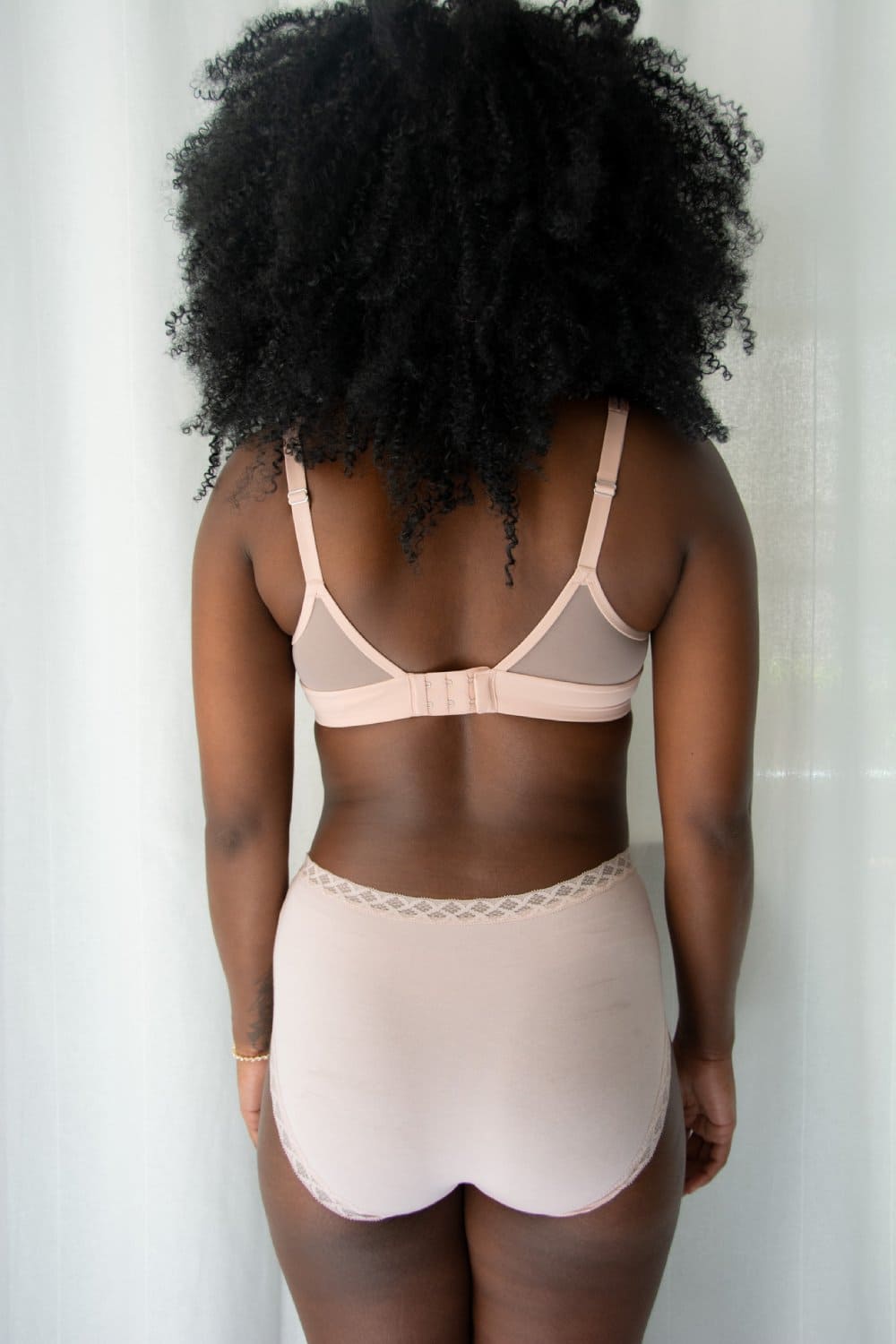 Natori Bliss full brief in rose beige, back view on a model, close-up.