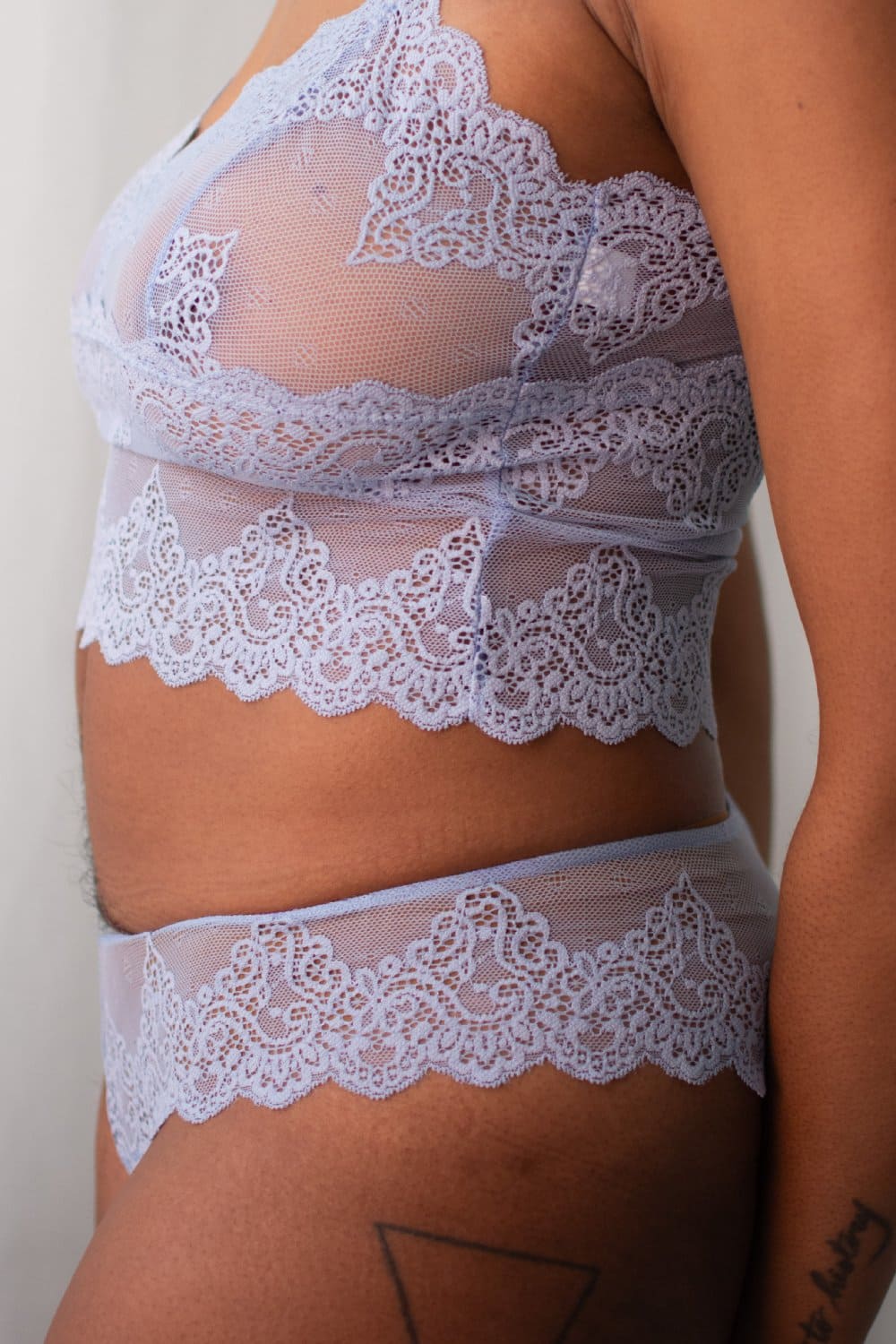 Only hearts so fine lace brazilian bikini in cascade, side view on a model, close-up.