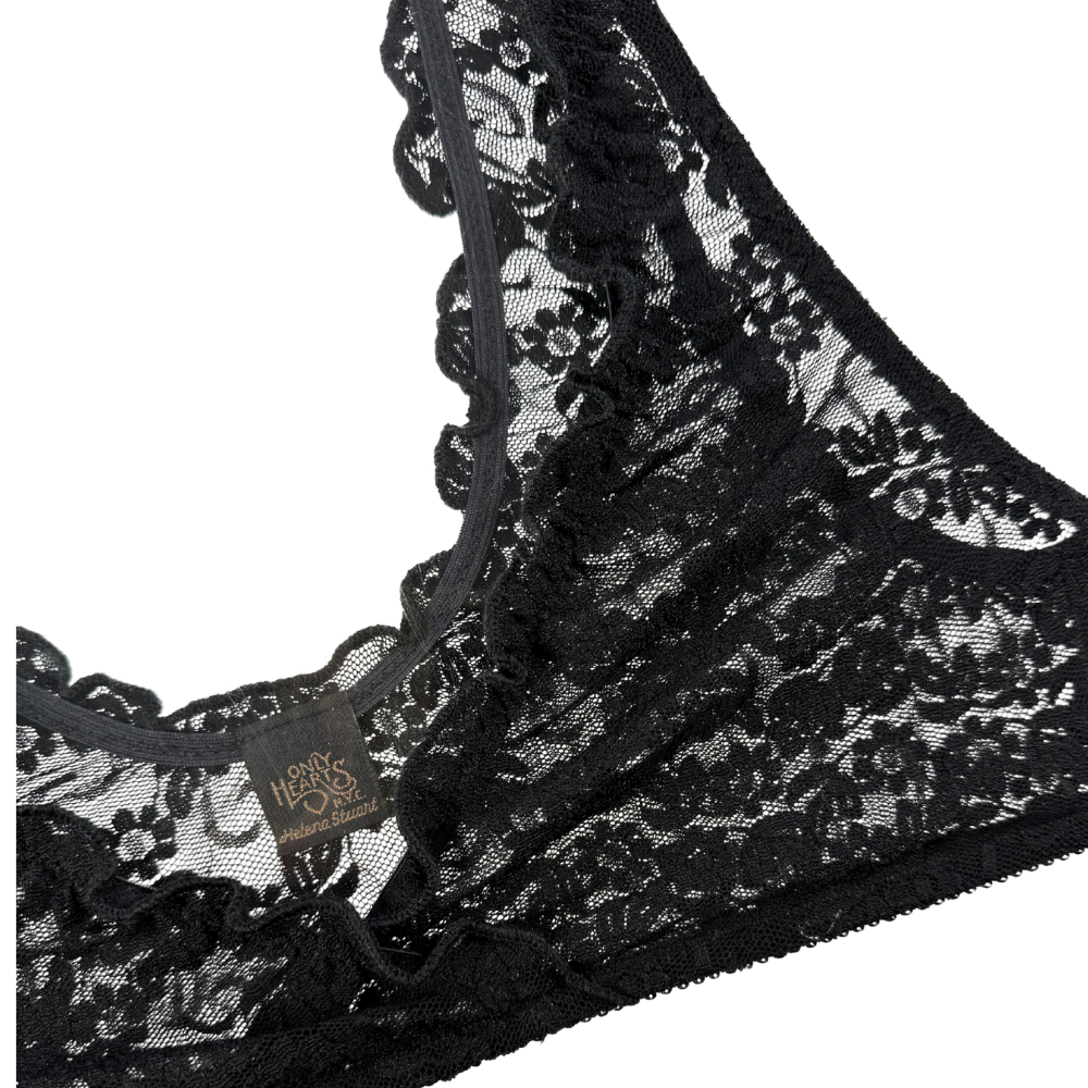 Black lace lingerie with a brand tag on a white background