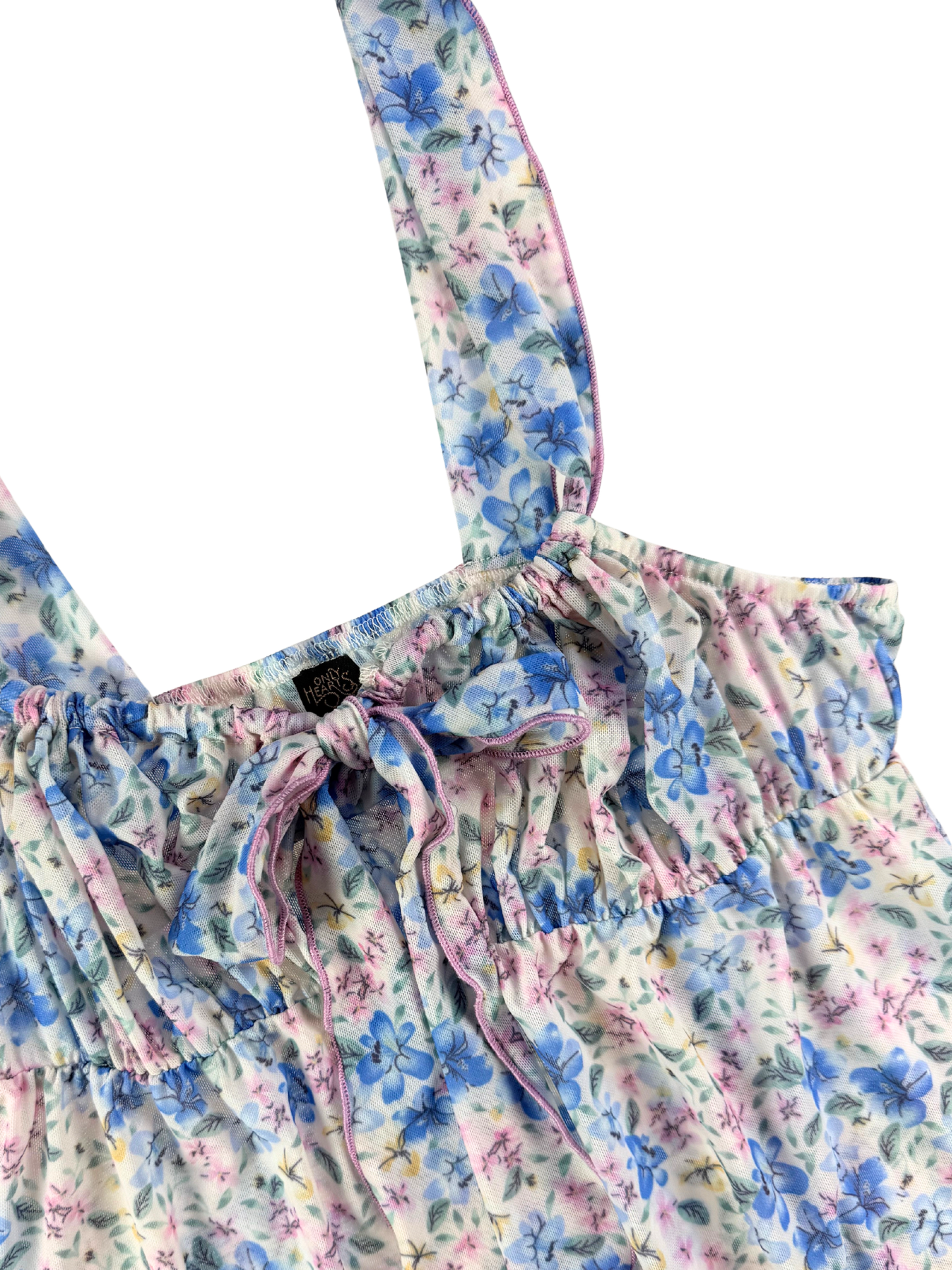Floral patterned dress with straps on a white background