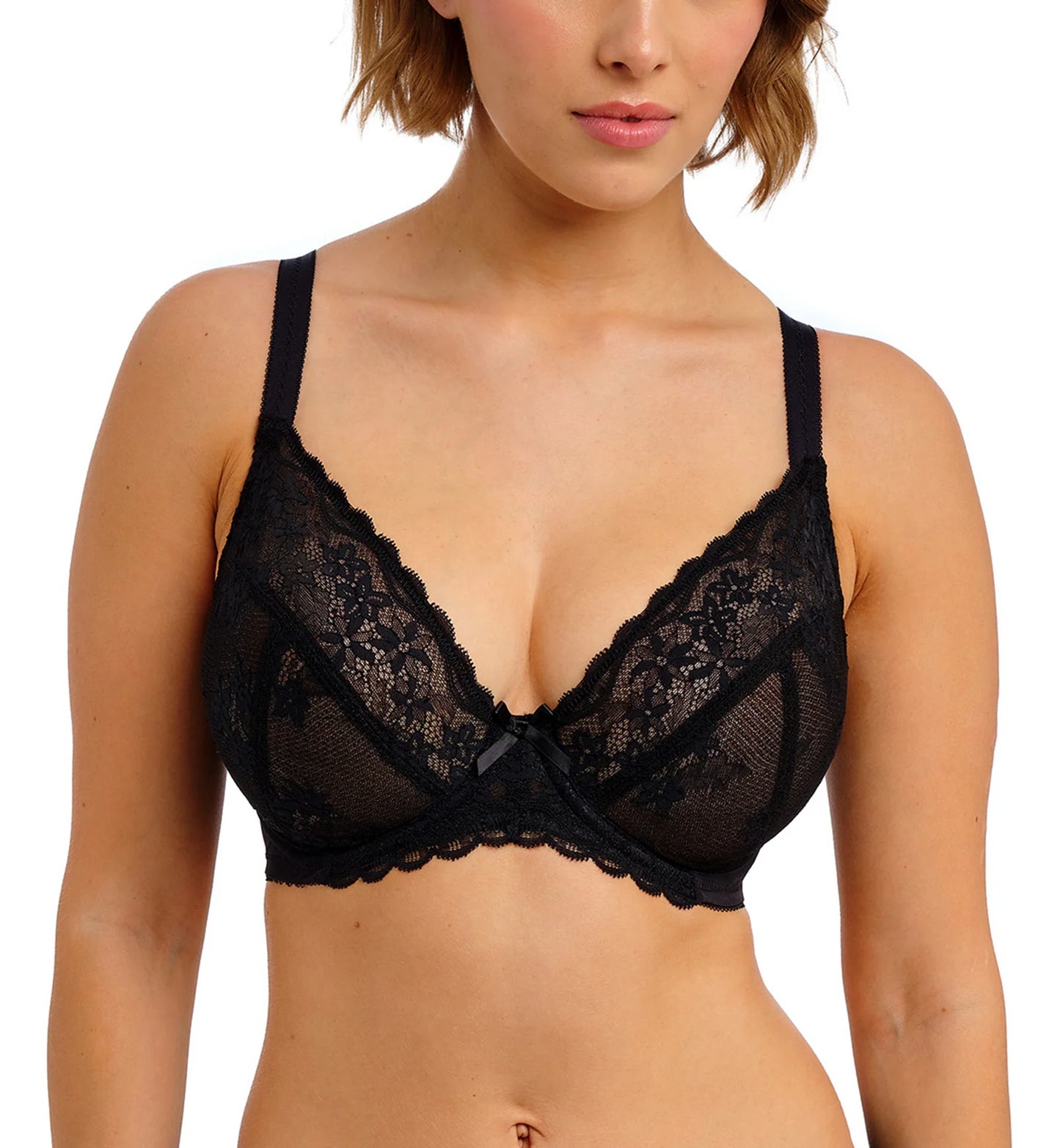 A black full-cup plunge bra on a model standing in front of a white background.