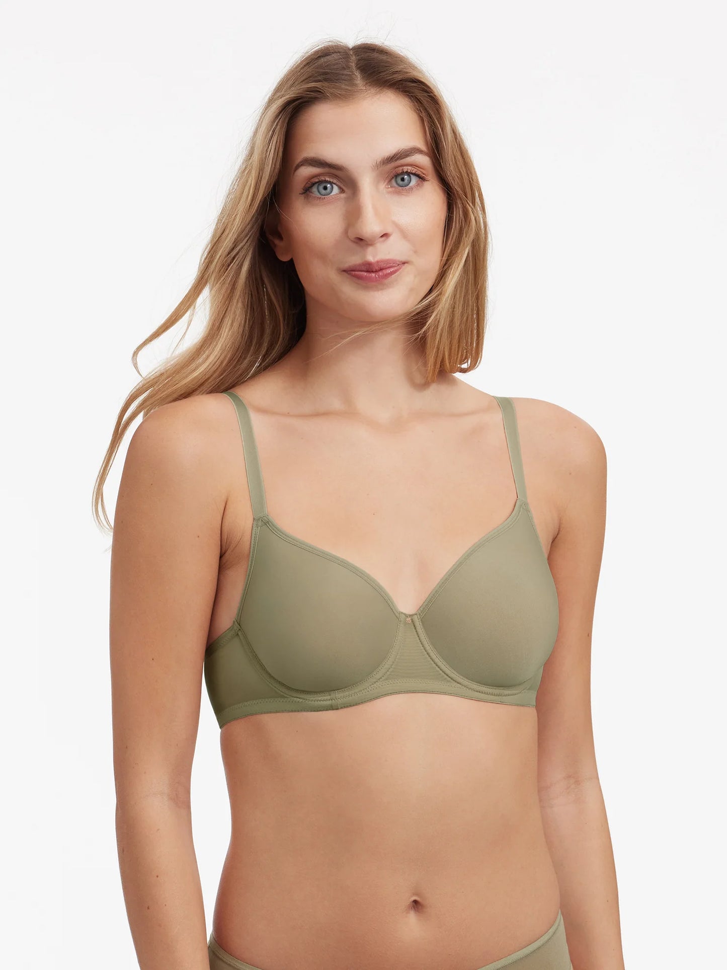 woman in olive green bra against a white background