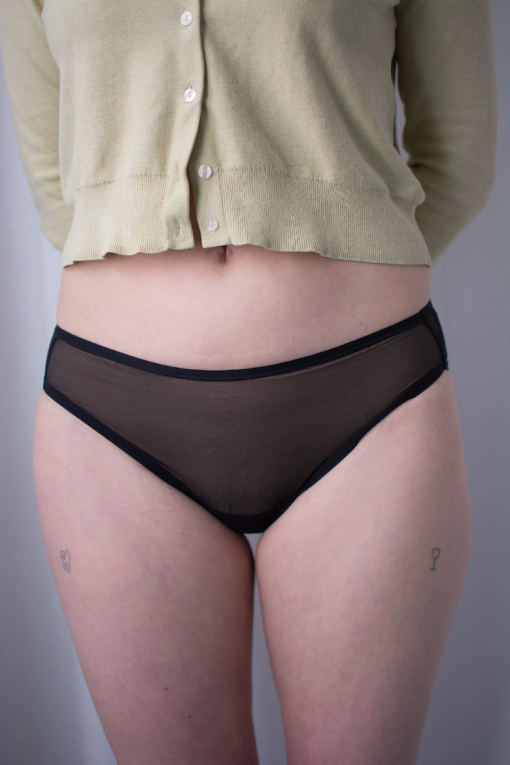 Skarlett blue spellbound bikini in black, front view on a model, close-up.