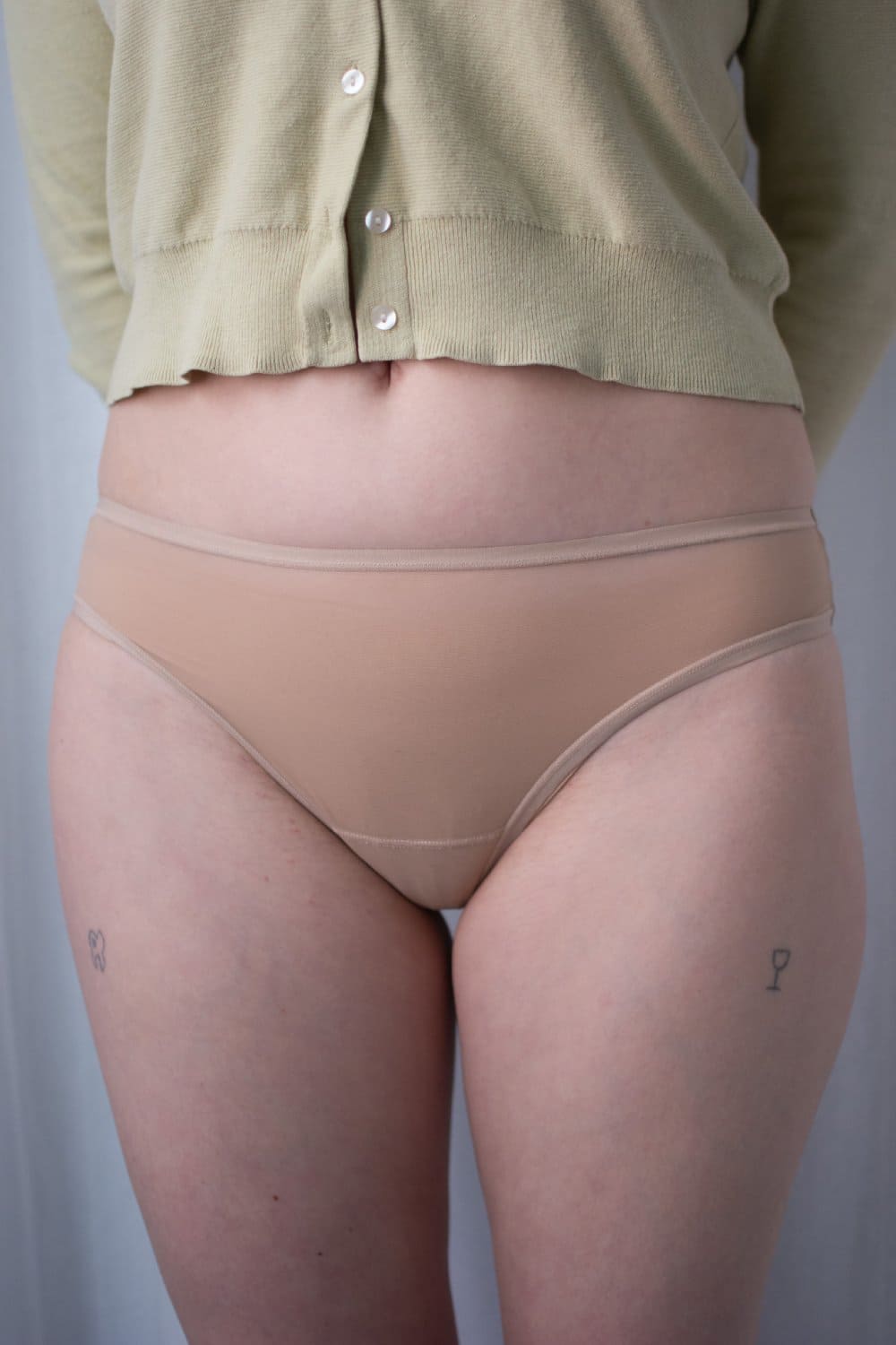 Skarlett blue spellbound nylon thong, front view on a model, close-up.