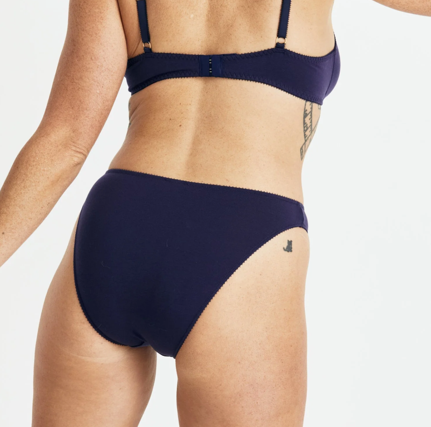 Navy blue bikini set on a plain background
