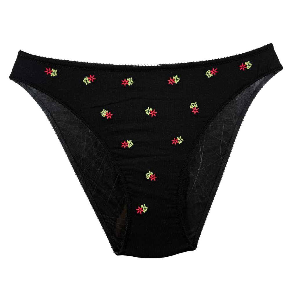 Black underwear with colorful floral patterns on a white background