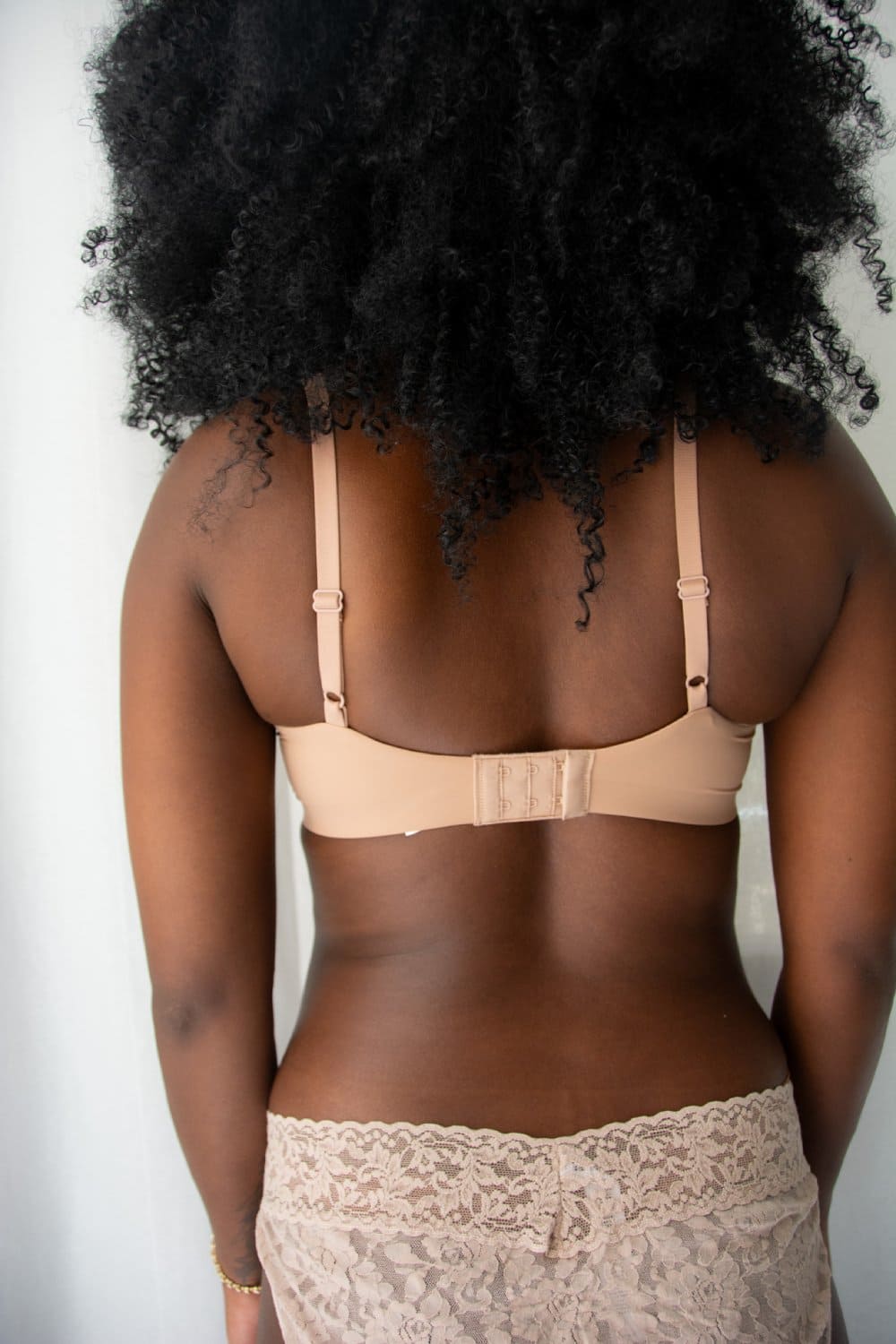 Wacoal comfort first t-shirt bra in roebuck, back close-up on a model.