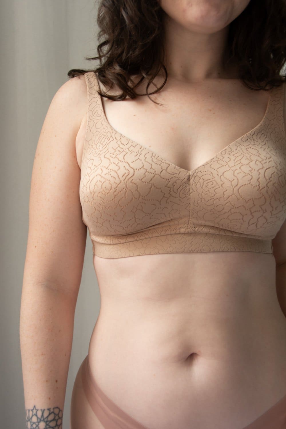 Wacoal inside job wire-free bra in roebuck, front waist-up view on a model.