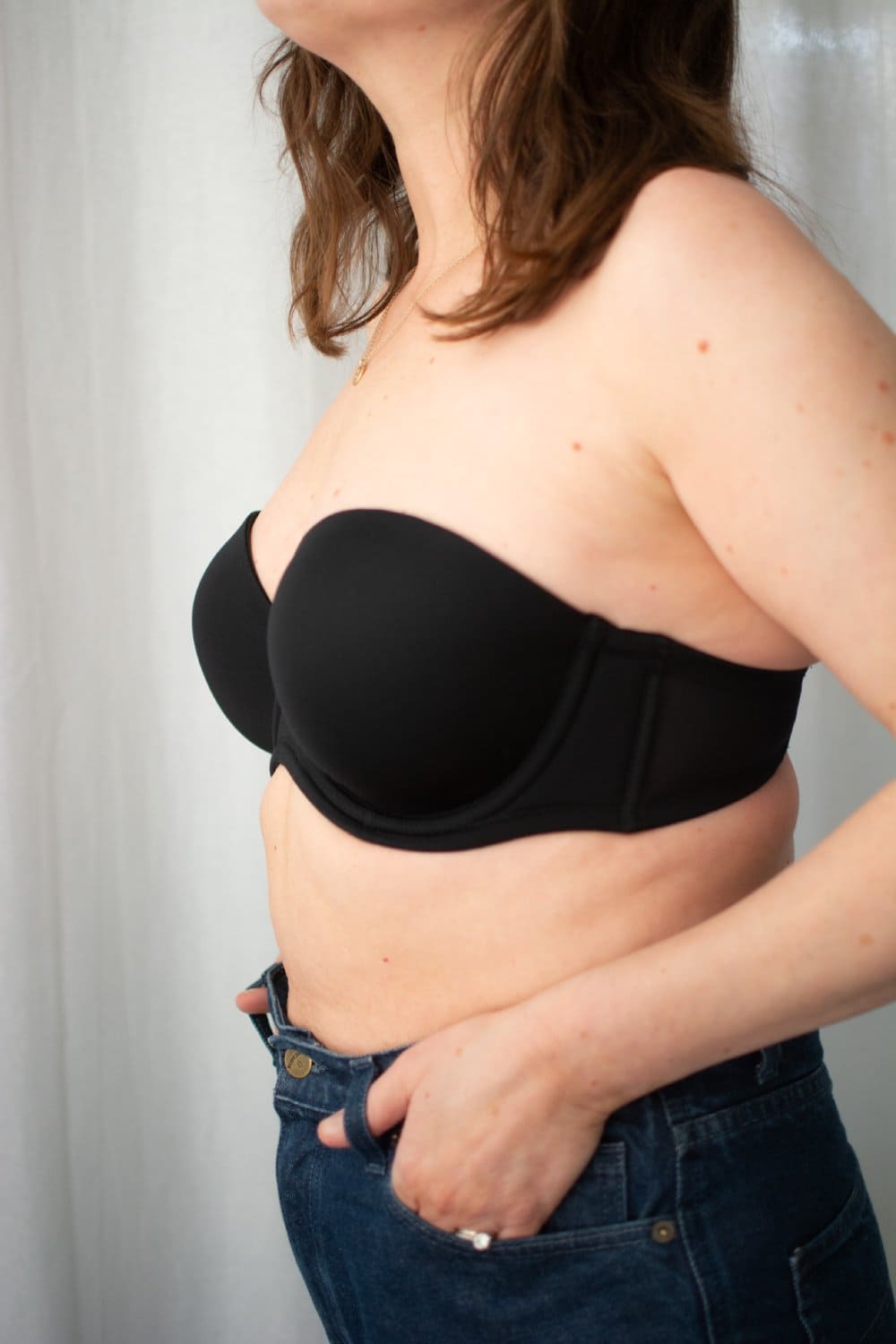 Wacoal red carpet strapless bra in black, side close-up on a model.