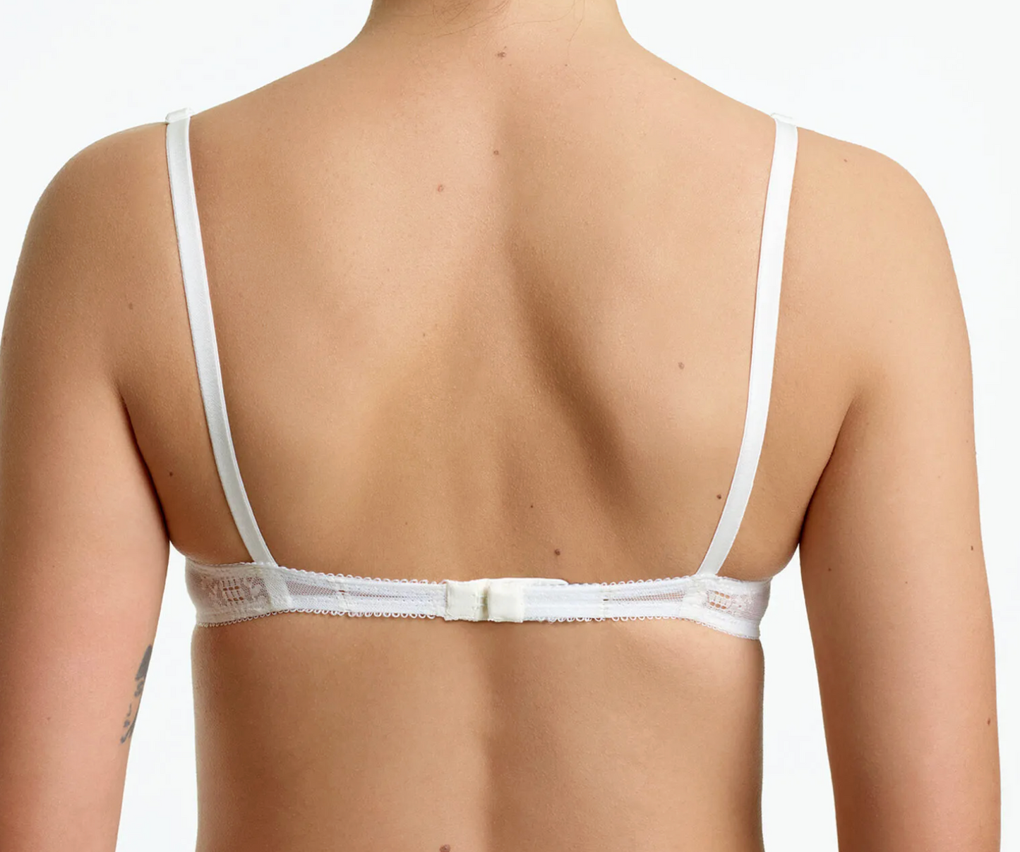 woman wearing white bra from back