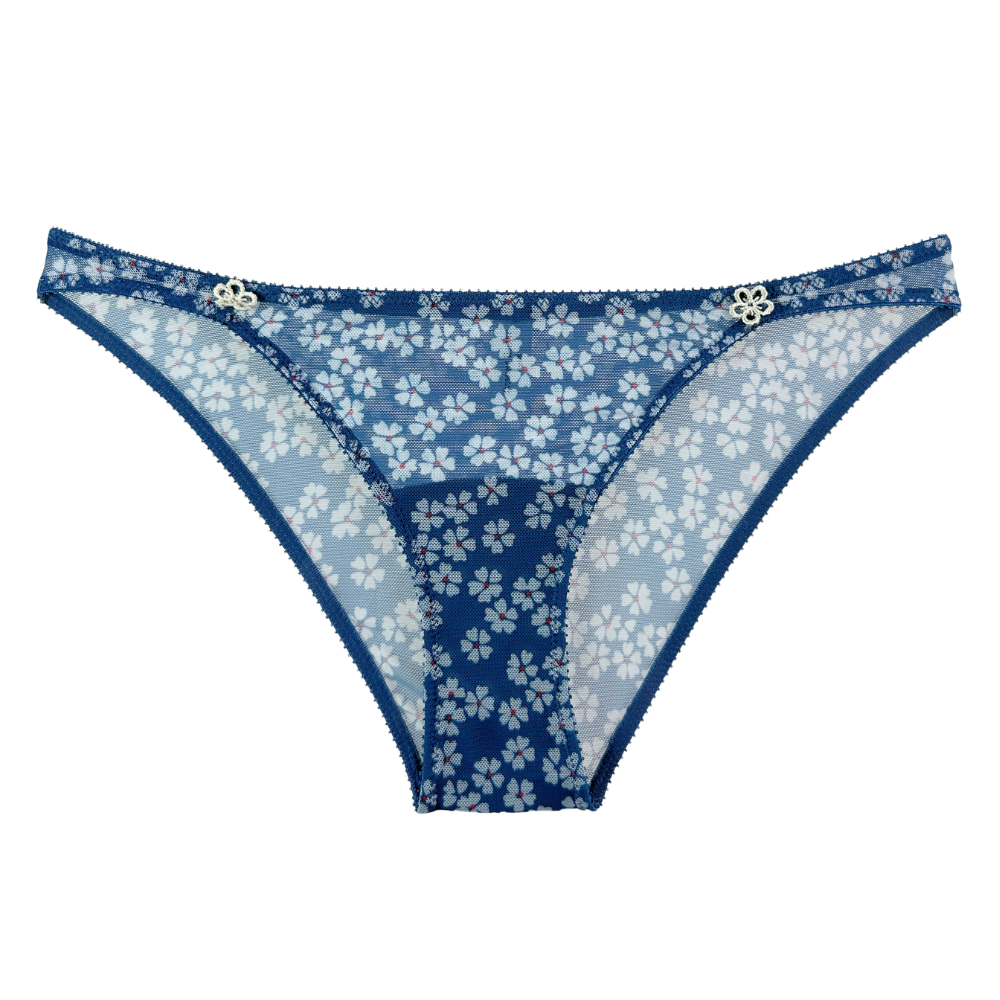 Blue floral lace thong underwear with a white cherry blossom pattern and small silver decorative accents on the waistband, shown against a plain white background.