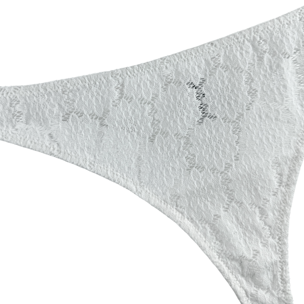 Close up of a white lace thong on a white background