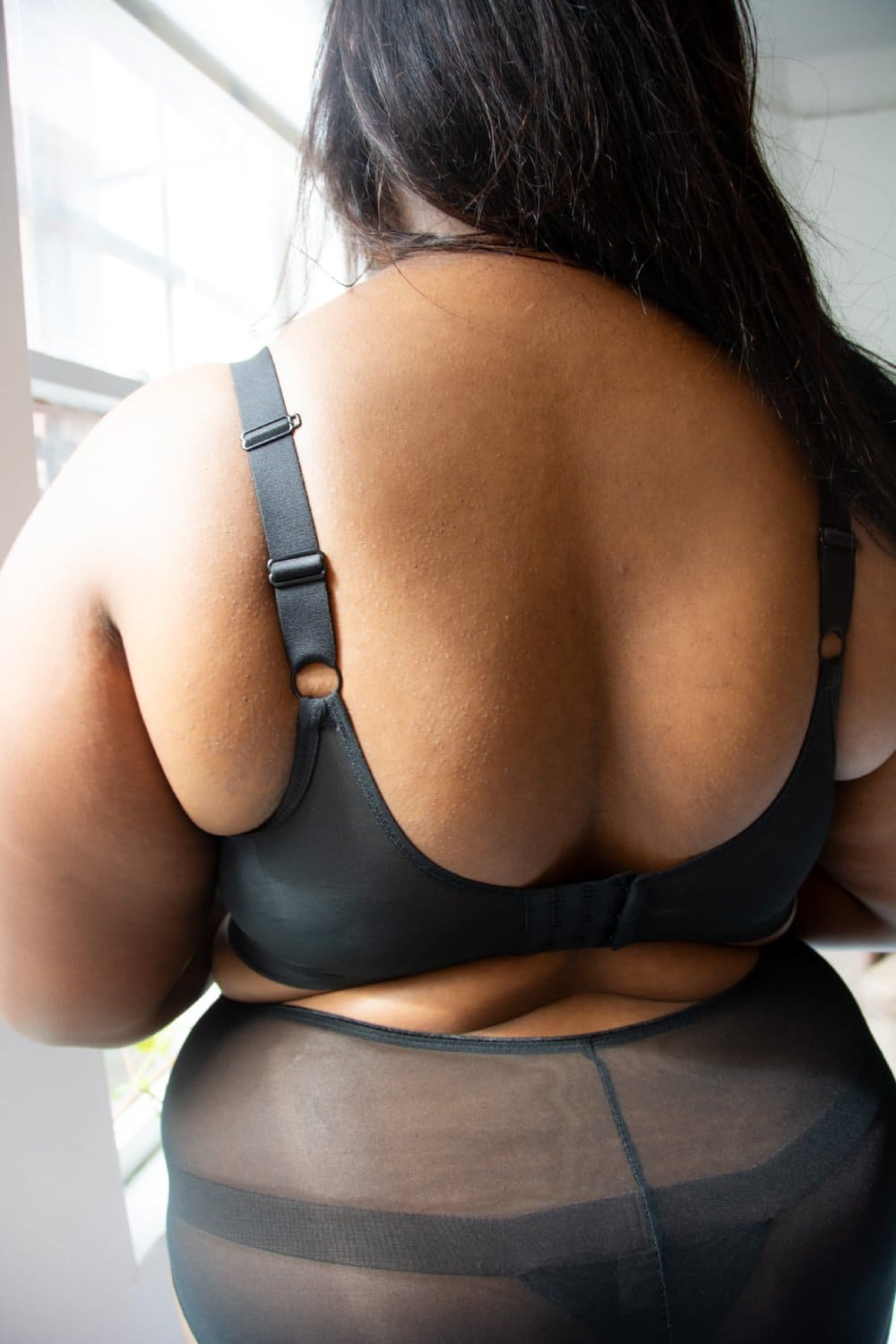 Elomi matilda plunge bra in black, back view on a model.