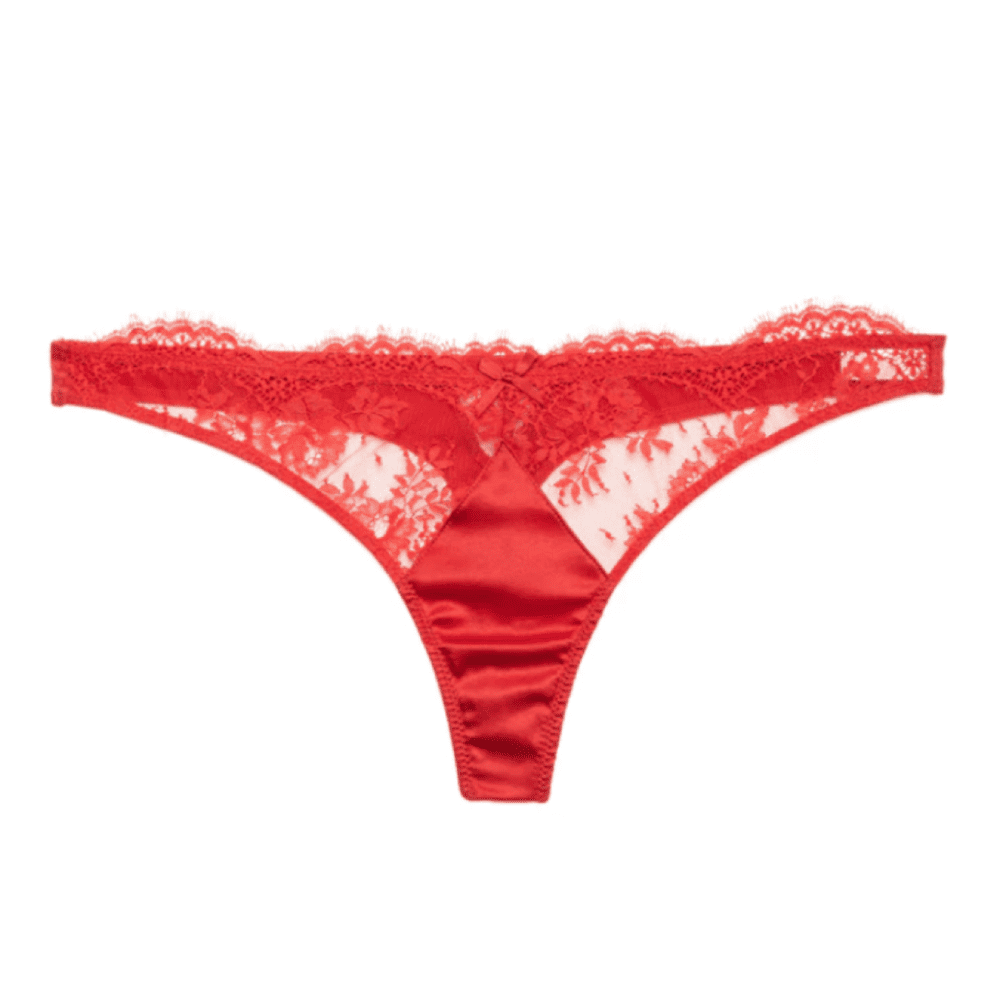 Fleur du mal frankie lace thong in rouge, close-up on white background.
