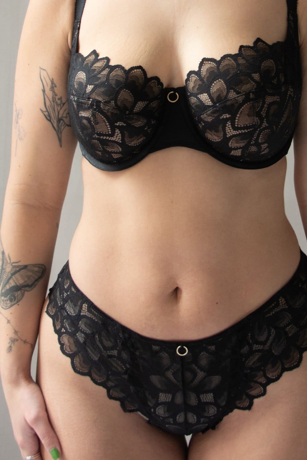 Panache allure demi balcony bra in black, front view on a model, close-up.