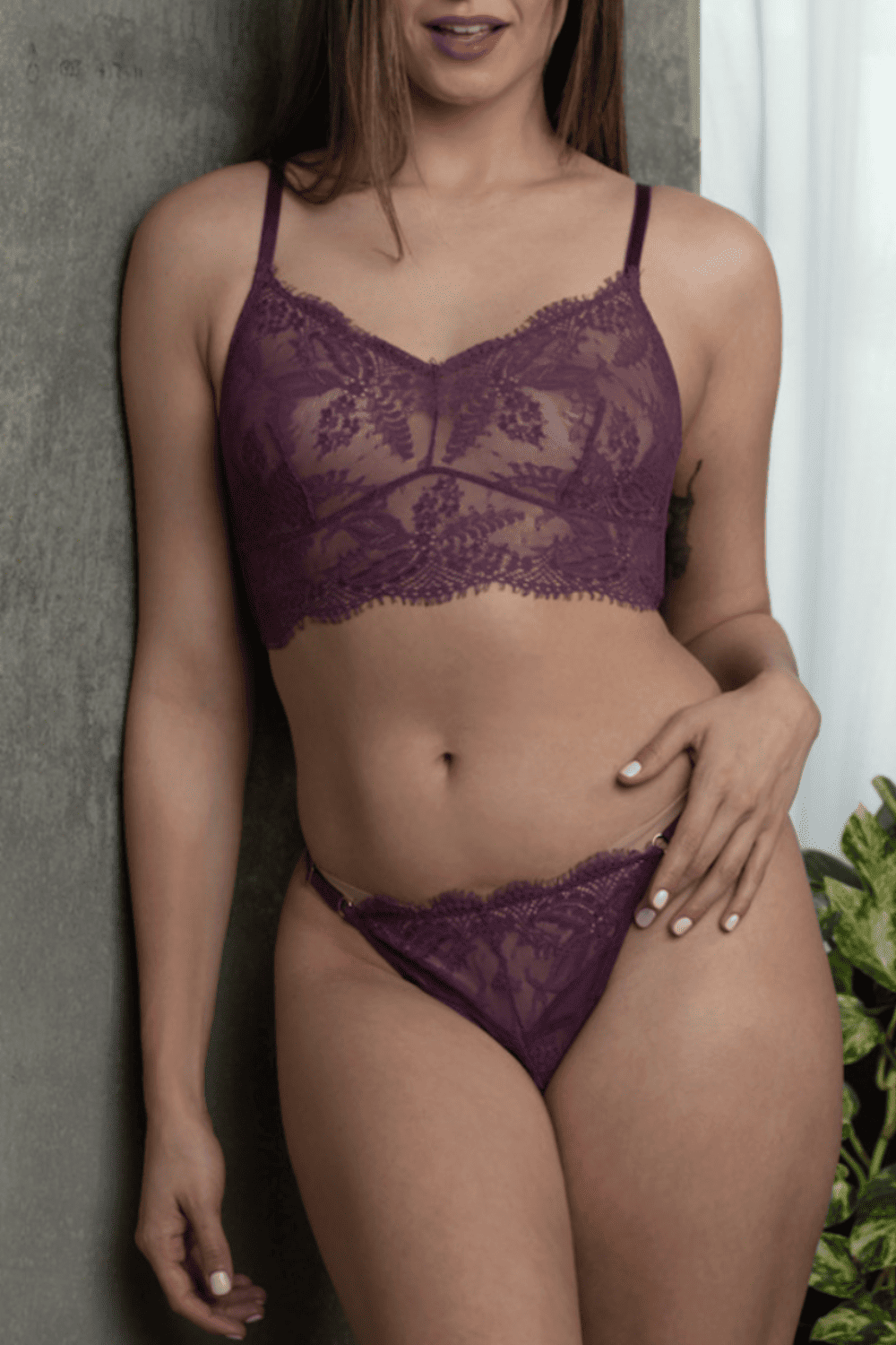 Samantha chang illusion longline wireless bra in dark berries, front view on a model, close-up.