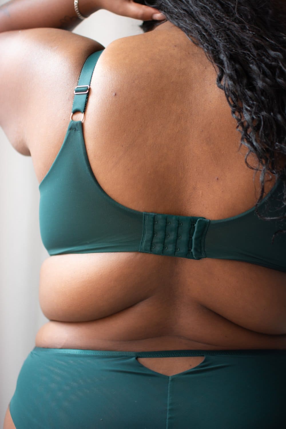 Sculptresse josephine full cup bra in forest green, back view on a model, close-up.